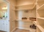 Amazing oversized closet with loads of built in shelving and cubbies for shoes or ?