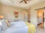 Main bedroom with coffered ceiling and ceiling fan