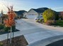 View from street of driveway & front landscaping.