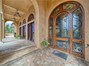 Beautifully tiled pathway and graceful archways lead you to the Main Entrance Door.