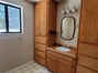View of upstairs bathroom with ample storage.