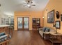 This bright living room is open to the kitchen and has a sliding glass door to the backyard