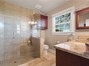 Primary bath- tile floors and large walk in shower