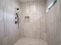 Massive walk in shower with dual shower heads.