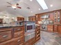 Slate Tile Floors, Custom Cherry Cabinets, Skylights with Remote Blinds, Warming Draw and Top of the Line Chef Appliances