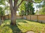Large fully fenced dog run with peek-a-boo fence so you can look in and see what your pup is doing.