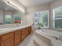 Master bathroom with double sinks and soaking tub