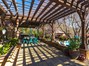 A portion of the back Pergola covered patio with Travertine Tile flooring.
