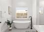 Stunning master bathroom w/ a focus on a decorative free standing tub
