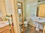 Near the laundry room, is your half bath. Since this is the far end of the house, it is handy to have a bathroom not far from the kitchen, the back yard, or the garage. This home is very well designed for space and comfort!