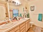 The Primary Bath also has double sinks, and plenty of storage. Check out what is behind door #1!