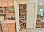 Checkout this nice big pantry cupboard! And notice there is a shelf for a Microwave, near the frig. By the way, Sellers will leave the washer, dryer and frig!