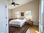 Master Bedroom with so many windows making it light & bright!