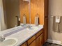 Double sinks and additional storage in master bathroom.