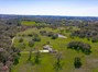 Aerial shot of the home with acreage