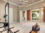 A GYM WITH A VIEW! CAN ALSO BE USED AT THE 5TH BEDROOM FEATURING A LARGE WALK IN CLOSET AND ACCESS TO THE OUTSIDE LANAI