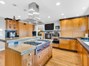 Chef's Dream Kitchen with custom cabinetry, plenty of work space, and dual Refrigerator, dual Freezer, dual Dishwashers.