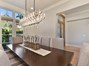 ... the formal dining area with decorator light fixtures and...