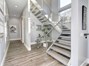 Stairs to the upper level that has Master Suite with Balcony and office